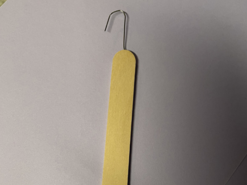 Zipper hook made out of a popsicle stick and paper clip