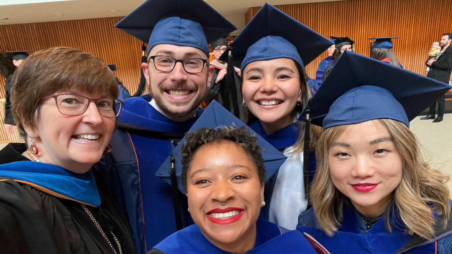 Four TechSAge students and Wendy Rogers at their hooding ceremony after receiving their PhDs from the University of Illinois Urbana-Champaign